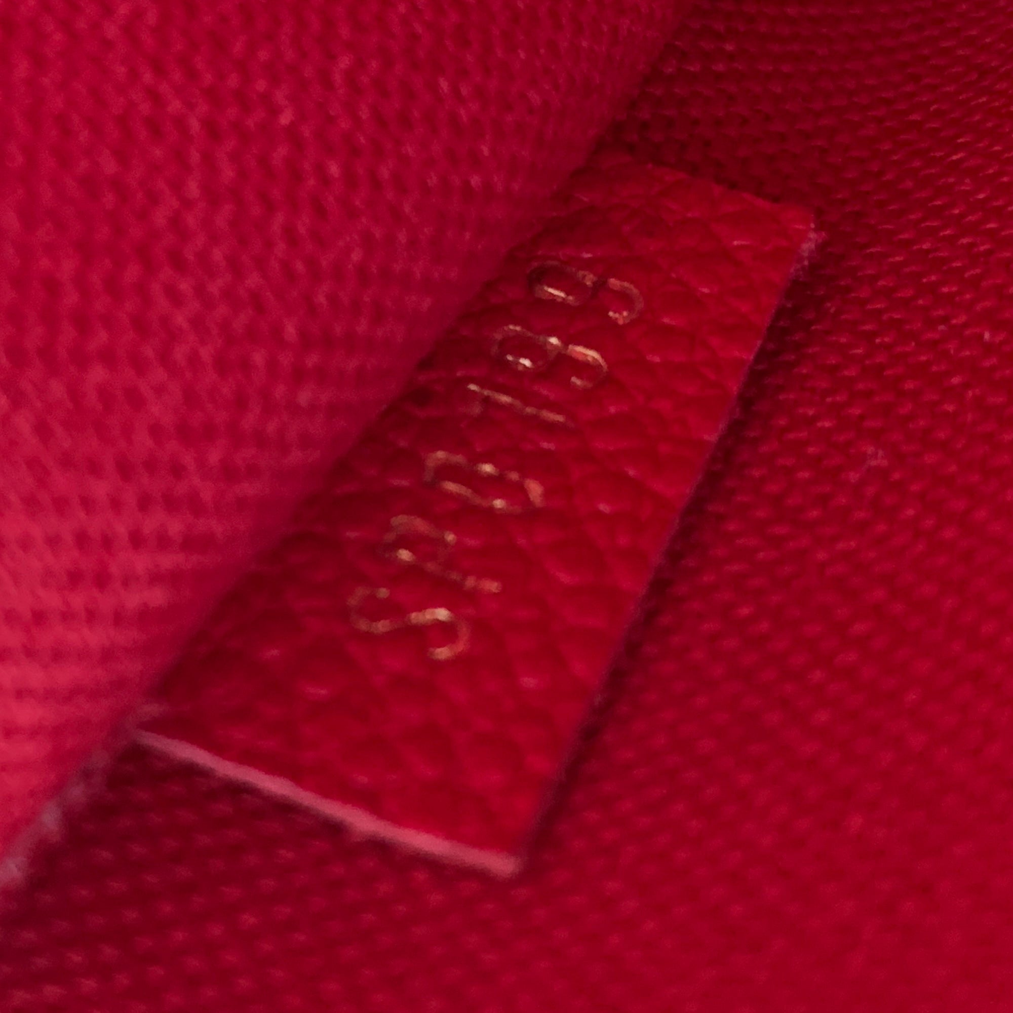 Louis Vuitton Red / Orange Empreinte Leather Mini Pochette SF1162 –  Exchange Collectibles