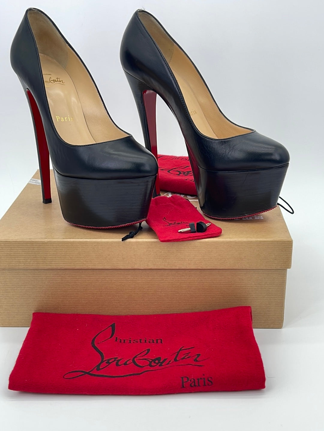 red bottom black heels